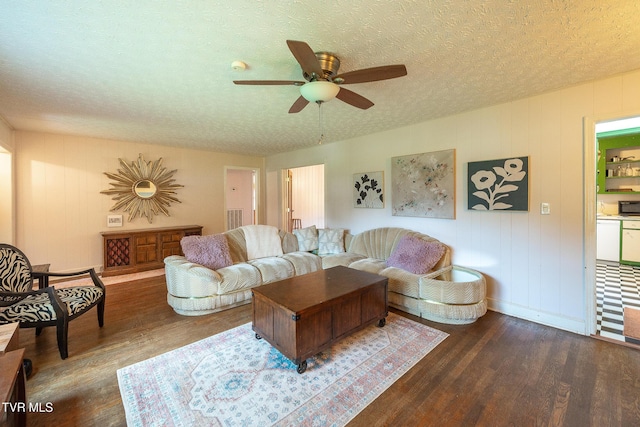 1024 Sharondale Ave, Kingsport, TN 37660 - living area featuring wood finished floors, a ceiling fan, a textured ceiling, and baseboards