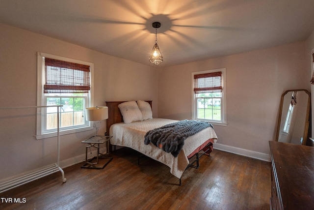1024 Sharondale Ave, Kingsport, TN 37660 - bedroom featuring dark wood-style flooring, multiple windows, and baseboards