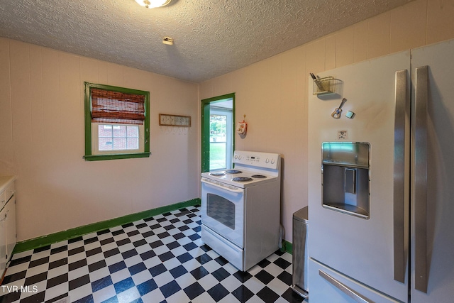 1024 Sharondale Ave, Kingsport, TN 37660 - kitchen featuring white appliances, tile patterned floors, and a textured ceiling