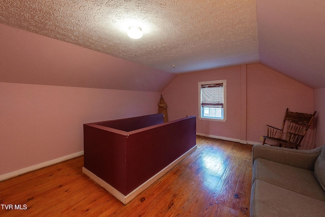 1024 Sharondale Ave, Kingsport, TN 37660 - unfurnished office featuring wood finished floors, baseboards, lofted ceiling, and a textured ceiling
