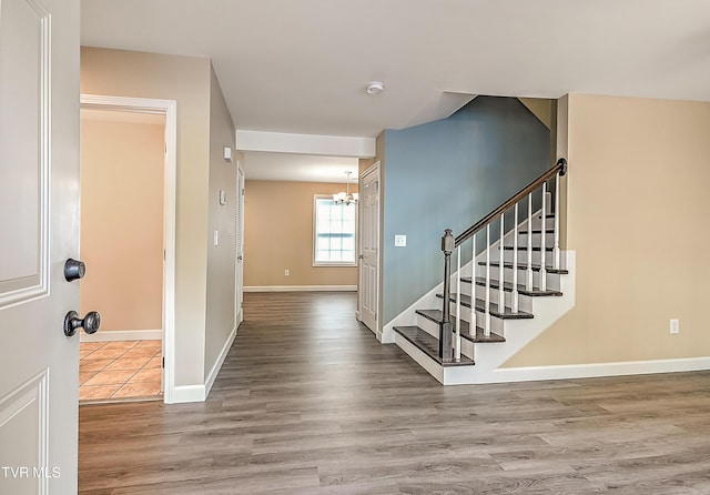 660 S Jena Beth Dr Unit 1, Elizabethton, TN 37643 - entryway featuring a chandelier, wood finished floors, and stairs