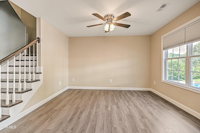 660 S Jena Beth Dr Unit 1, Elizabethton, TN 37643 - empty room with wood finished floors, a ceiling fan, and stairway