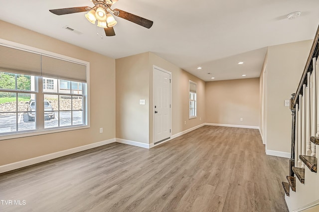 660 S Jena Beth Dr Unit 1, Elizabethton, TN 37643 - empty room with healthy amount of natural light, light wood-style floors, ceiling fan, stairway, and recessed lighting