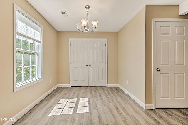 660 S Jena Beth Dr Unit 1, Elizabethton, TN 37643 - unfurnished dining area featuring a chandelier and light wood-type flooring