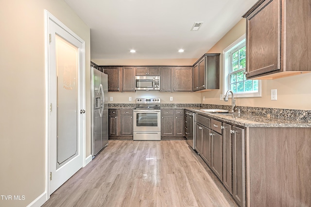 660 S Jena Beth Dr Unit 1, Elizabethton, TN 37643 - kitchen featuring appliances with stainless steel finishes, light wood-style flooring, stone countertops, recessed lighting, and dark brown cabinets