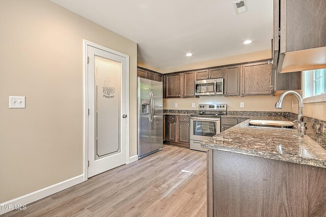 660 S Jena Beth Dr Unit 1, Elizabethton, TN 37643 - kitchen featuring stainless steel appliances, light wood-style flooring, stone counters, dark brown cabinets, and recessed lighting