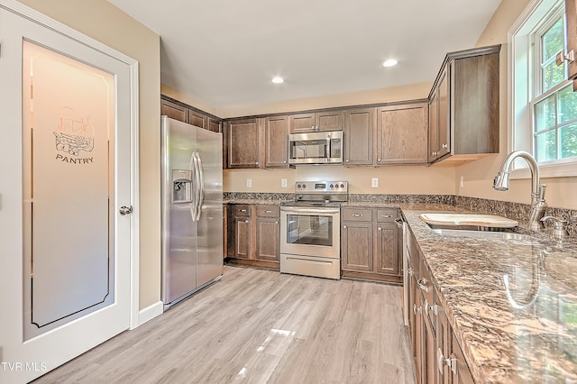 660 S Jena Beth Dr Unit 1, Elizabethton, TN 37643 - kitchen featuring appliances with stainless steel finishes, light wood-style floors, stone counters, recessed lighting, and dark brown cabinets