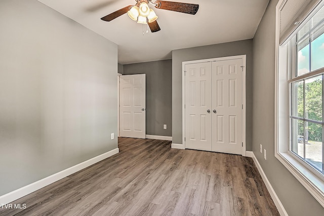 660 S Jena Beth Dr Unit 1, Elizabethton, TN 37643 - unfurnished bedroom featuring wood finished floors, a closet, and a ceiling fan