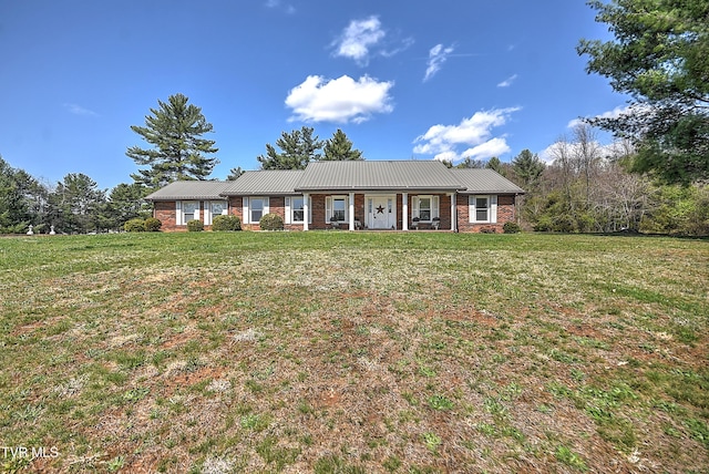 646 Meadow View Rd, Bristol, TN 37620 - view of front of home with a front yard, metal roof, and brick siding