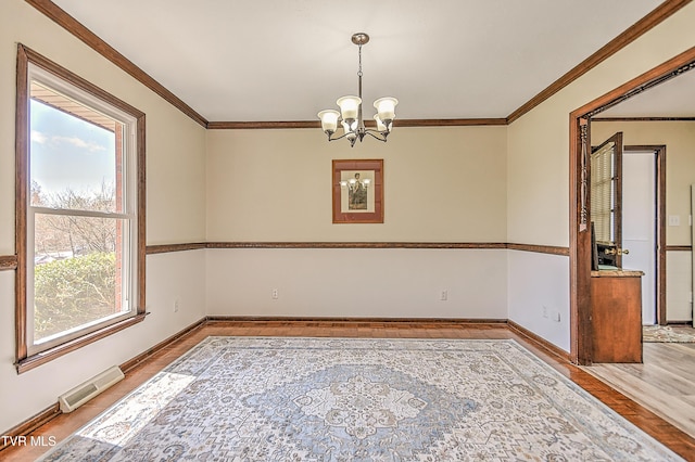 646 Meadow View Rd, Bristol, TN 37620 - empty room with a chandelier, crown molding, baseboards, and wood finished floors