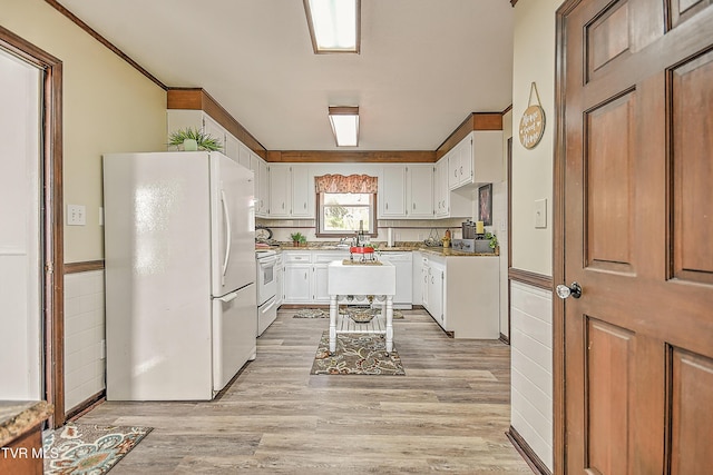 646 Meadow View Rd, Bristol, TN 37620 - kitchen featuring white appliances, white cabinets, light wood-style floors, and light countertops