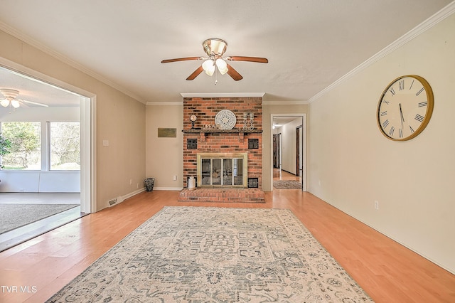646 Meadow View Rd, Bristol, TN 37620 - living area with a ceiling fan, wood finished floors, a brick fireplace, and crown molding