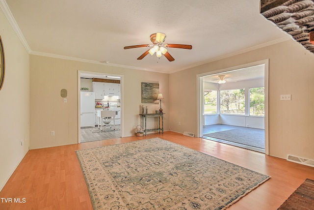 646 Meadow View Rd, Bristol, TN 37620 - spare room featuring ceiling fan, light wood-style floors, and crown molding