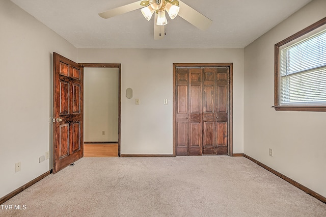 646 Meadow View Rd, Bristol, TN 37620 - unfurnished bedroom with light colored carpet, a closet, baseboards, and ceiling fan