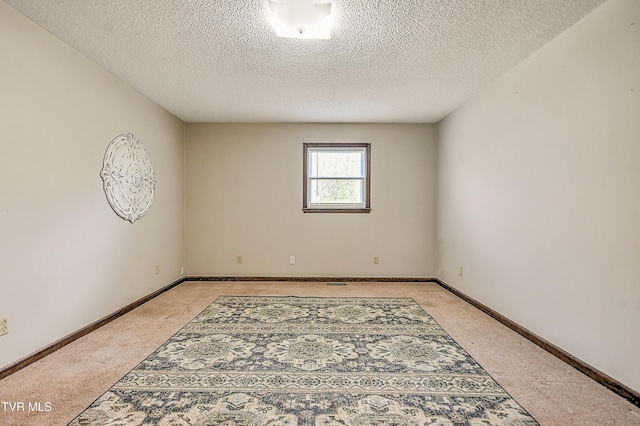 646 Meadow View Rd, Bristol, TN 37620 - unfurnished room with light carpet, a textured ceiling, and baseboards