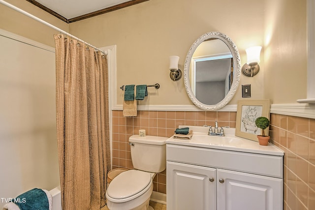 646 Meadow View Rd, Bristol, TN 37620 - full bath with tile walls, vanity, toilet, ornamental molding, and wainscoting