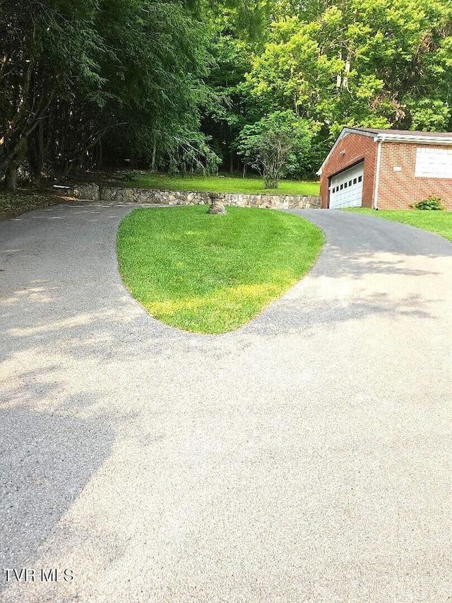 919 Coeburn Rd, Wise, VA 24293 - view of front of home featuring asphalt driveway, an outdoor structure, and a garage