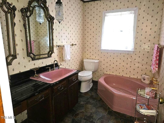 919 Coeburn Rd, Wise, VA 24293 - bathroom featuring vanity, a bath, wallpapered walls, toilet, and stone finish floors