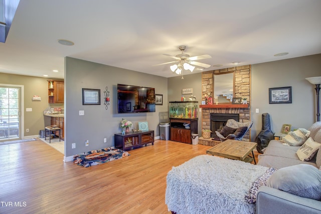 1032 Austin Ridge Ct, Piney Flats, TN 37686 - living area with a ceiling fan, a stone fireplace, light wood-style flooring, and recessed lighting