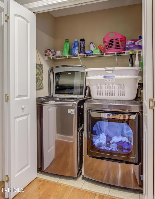 1032 Austin Ridge Ct, Piney Flats, TN 37686 - laundry room featuring washing machine and clothes dryer and light tile patterned floors