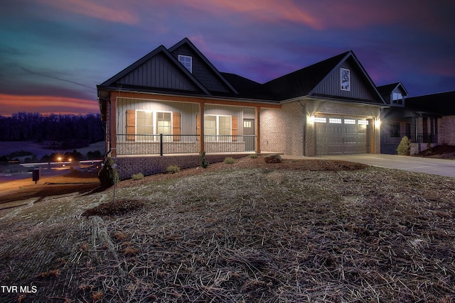 2406 Haystack Cir, Piney Flats, TN 37686 - view of front of property featuring covered porch, concrete driveway, and an attached garage