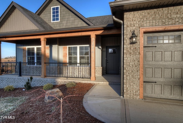 2406 Haystack Cir, Piney Flats, TN 37686 - entrance to property with a porch, stone siding, a shingled roof, and board and batten siding