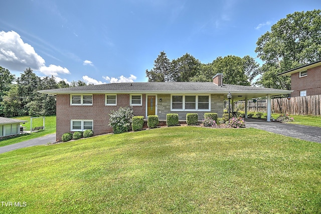 404 Stuffle St, Kingsport, TN 37660 - view of front of property featuring driveway, a chimney, a carport, brick siding, and stone siding