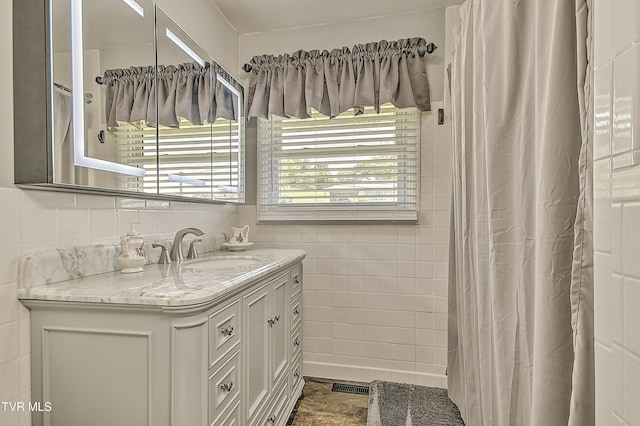 404 Stuffle St, Kingsport, TN 37660 - bathroom with tile walls, vanity, and curtained shower