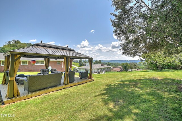 404 Stuffle St, Kingsport, TN 37660 - view of grassy yard featuring a gazebo, an outdoor living space, and a wooden deck