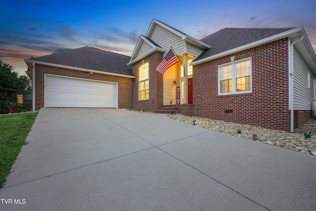 1844 Weaver Branch Rd, Piney Flats, TN 37686 - view of front facade featuring brick siding, a garage, driveway, and a shingled roof