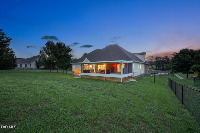 1844 Weaver Branch Rd, Piney Flats, TN 37686 - back of house at dusk featuring a fenced backyard