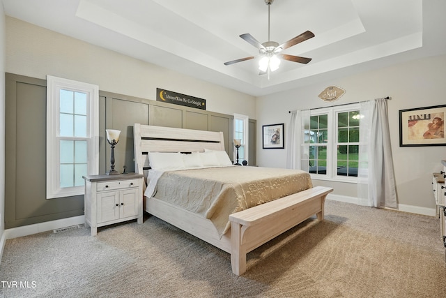 1844 Weaver Branch Rd, Piney Flats, TN 37686 - bedroom with a tray ceiling, light colored carpet, and ceiling fan