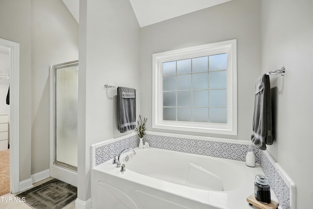 1844 Weaver Branch Rd, Piney Flats, TN 37686 - bathroom featuring a bath, a stall shower, and vaulted ceiling
