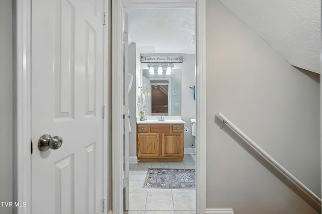 1844 Weaver Branch Rd, Piney Flats, TN 37686 - half bathroom featuring tile patterned flooring, vanity, and a textured ceiling
