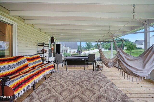 1844 Weaver Branch Rd, Piney Flats, TN 37686 - sunroom / solarium featuring beamed ceiling, a wooden deck, plenty of natural light, and wood finished floors