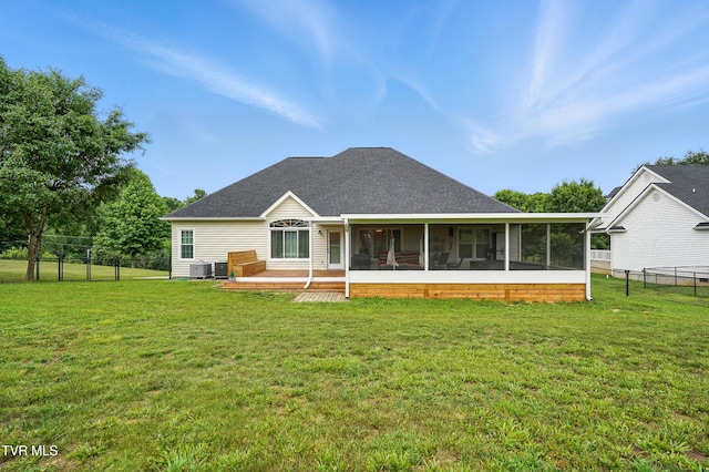 1844 Weaver Branch Rd, Piney Flats, TN 37686 - back of house featuring a sunroom, a fenced backyard, a deck, and a shingled roof