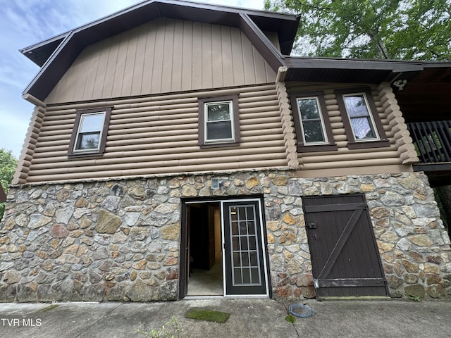 2401 Egan Rd, Big Stone Gap, VA 24219 - view of front facade featuring stone siding, log siding, and a gambrel roof