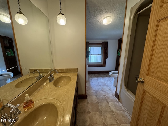 2401 Egan Rd, Big Stone Gap, VA 24219 - full bathroom with a textured ceiling, double vanity, and bathtub / shower combination