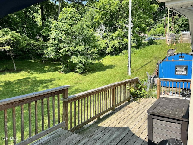 692 NE Hamner Ave, Norton, VA 24273 - wooden deck featuring a lawn and a storage shed