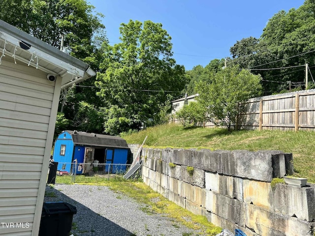 692 NE Hamner Ave, Norton, VA 24273 - fenced backyard with a storage unit