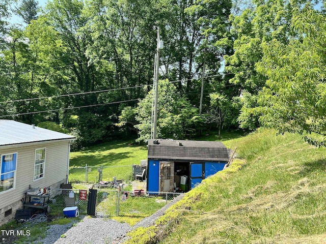 692 NE Hamner Ave, Norton, VA 24273 - view of yard featuring a storage unit and a gate