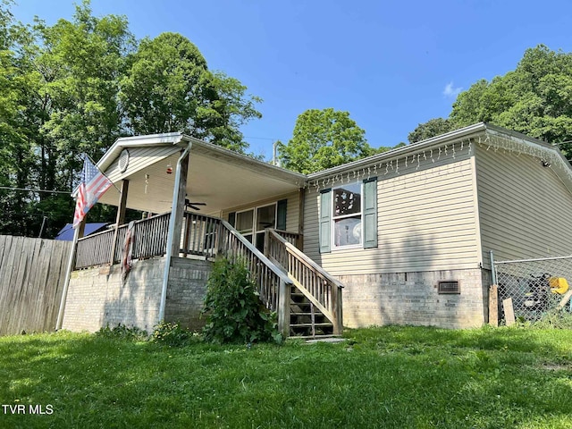 692 NE Hamner Ave, Norton, VA 24273 - rear view of property with ceiling fan, stairs, and crawl space