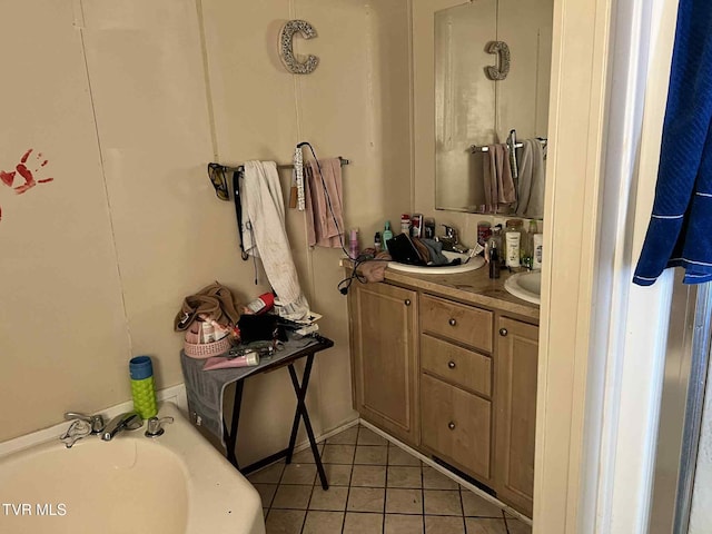 692 NE Hamner Ave, Norton, VA 24273 - bathroom with tile patterned flooring, vanity, and a bath