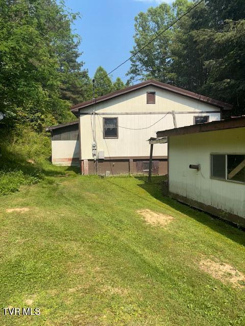 11616 Alfred Cox Rd, Pound, VA 24279 - view of home's exterior with a lawn