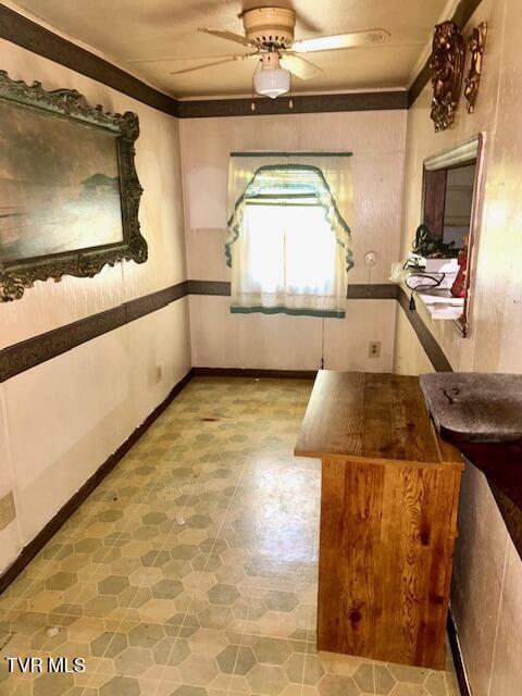 11616 Alfred Cox Rd, Pound, VA 24279 - unfurnished room with tile patterned floors, ceiling fan, and ornamental molding