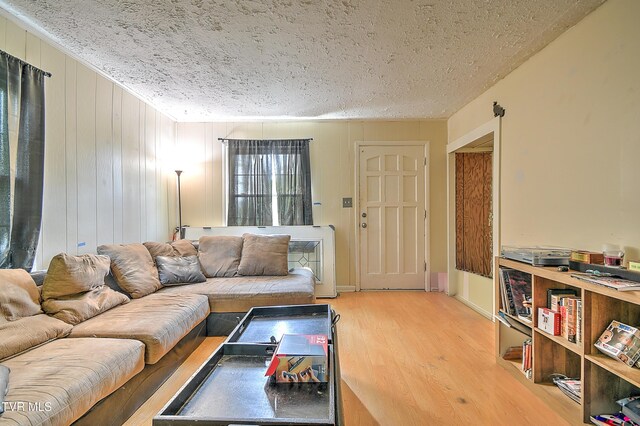 11 Birch St, Bristol, TN 37620 - living area with wood finished floors and a textured ceiling