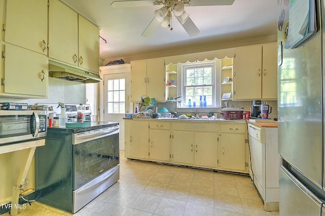 11 Birch St, Bristol, TN 37620 - kitchen featuring stainless steel appliances, under cabinet range hood, cream cabinetry, open shelves, and ceiling fan