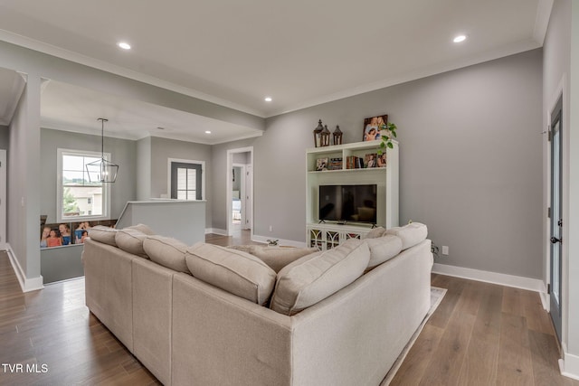 3137 London Rd, Kingsport, TN 37664 - living room featuring recessed lighting, wood finished floors, a chandelier, and crown molding
