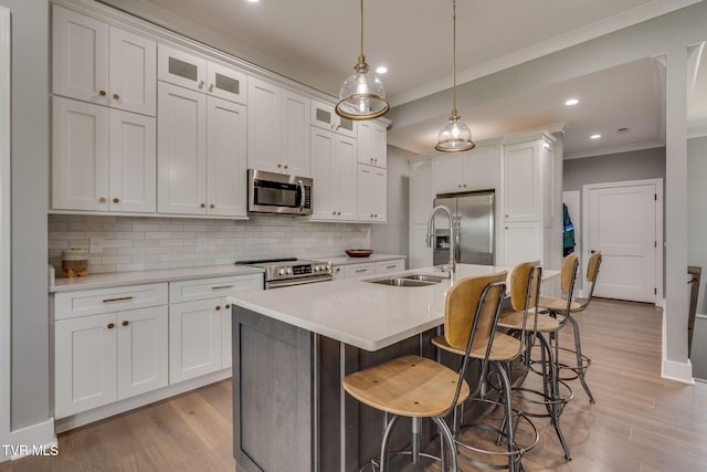 3137 London Rd, Kingsport, TN 37664 - kitchen featuring stainless steel appliances, ornamental molding, backsplash, light wood-style floors, and recessed lighting