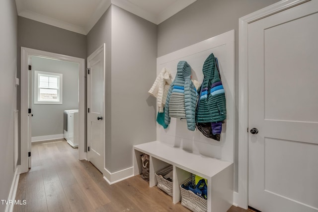 3137 London Rd, Kingsport, TN 37664 - mudroom featuring washer / dryer, light wood finished floors, and ornamental molding
